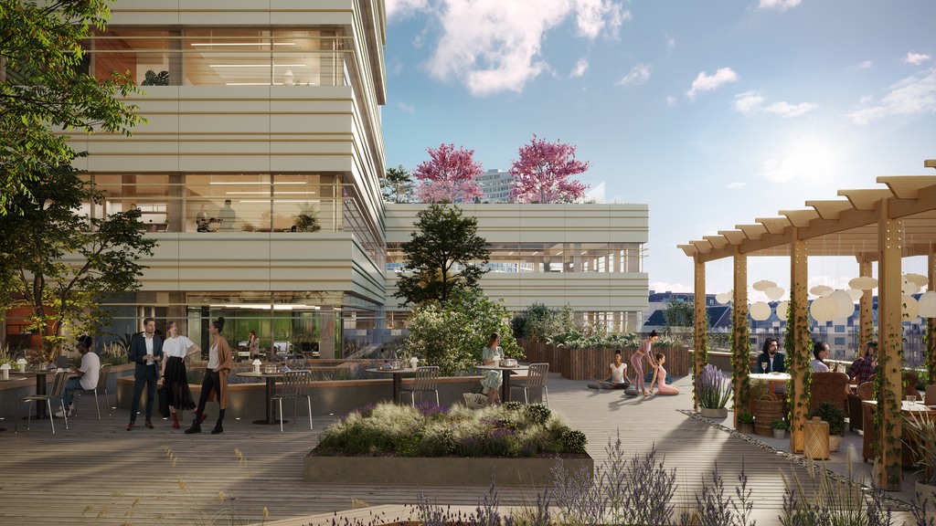 Kontorsfastigheten Vista i Hyllie har en vit fasad med blomster och grönska.