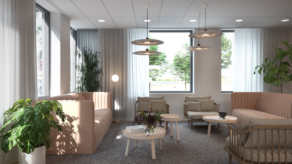 Möteslounge med soffor och stora fönster 