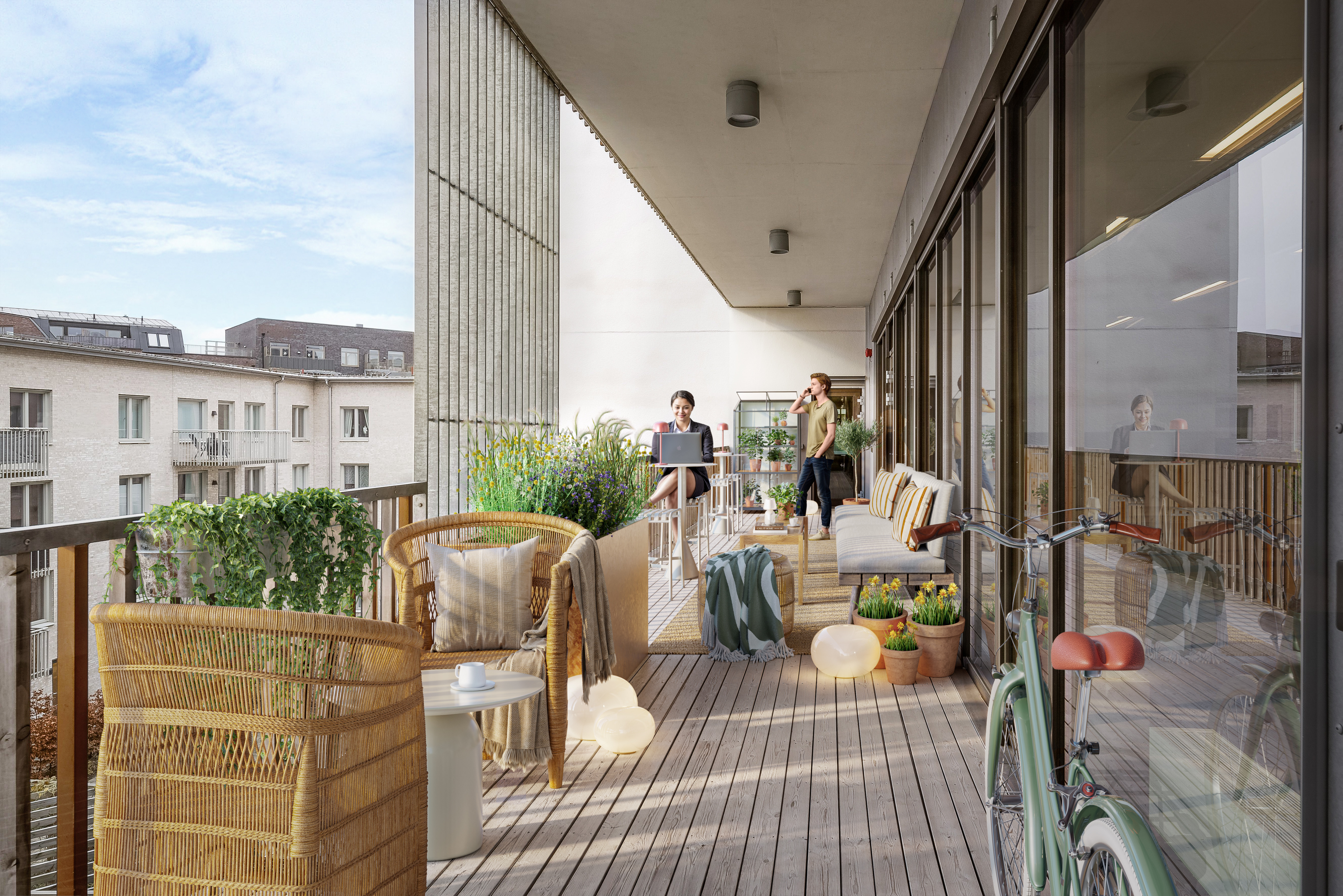 Man som står ute på balkongen och ser ut över Hyllie. I kontshuset Origo finns det baolkonger på varje våningsplan. 