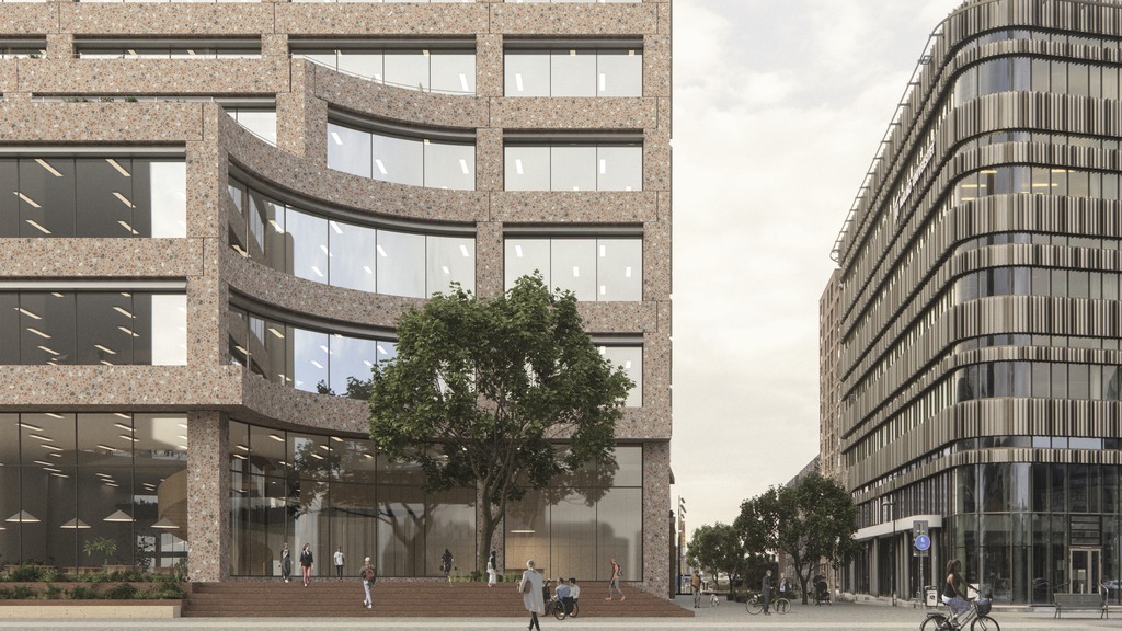 En visionsbild som visar den färdiga byggnaden  i universitetsområdet. Personer går utanför.