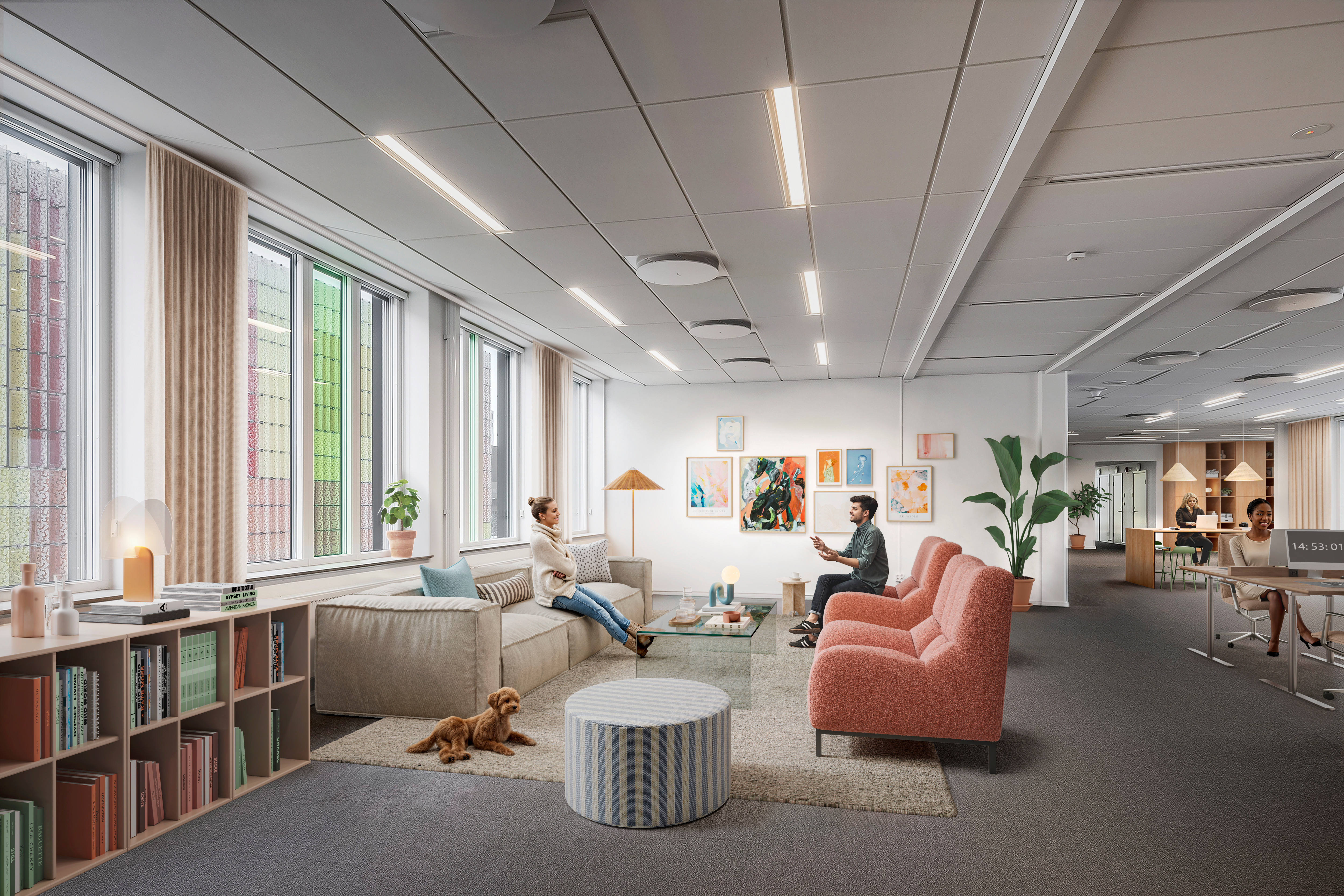 Kontorshuset Origo i Hyllie har snedtak och balkonger på varje våningsplan. En kvinna sitter på en kontorsstol intill snedtaket. 